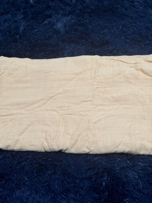 Burnt yellow colored lightweight blanket